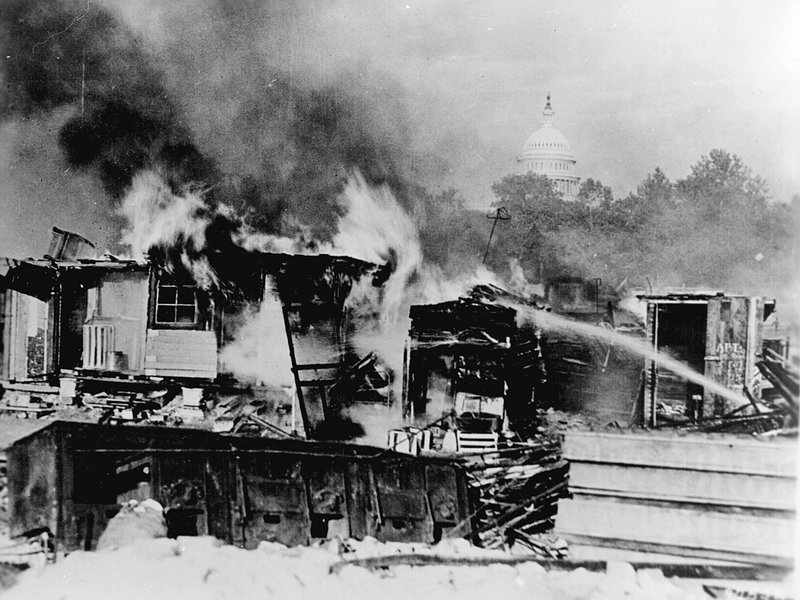 The Bonus Army encampment burns with the U.S. Capitol in the background (National Archives)